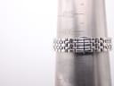 Watch bracelet displayed on a metal wrist sizing cone, indicating a current fit size of approximately 150mm (50 units).