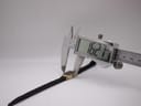 Digital caliper measuring the case diameter of the Bulova SL200, displaying 16.27mm.