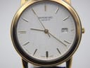 Close-up of the Raymond Weil dial, showing the textured pattern, gold baton markers, date window at 3, and "Swiss Made" text.