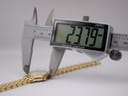 Digital caliper measuring the case diameter of the Raymond Weil watch, displaying an exact reading of 23.79mm.