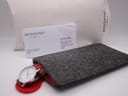 Inclusions: Mondaine felt pouch, warranty card, and paper sleeve with the watch.
