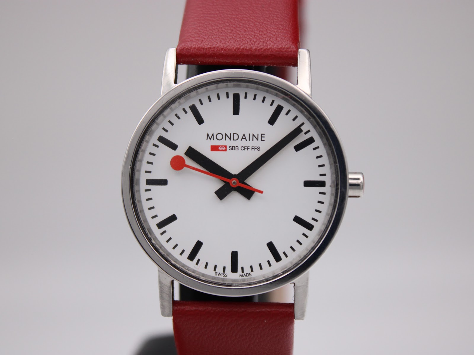 Close-up front view of the Mondaine watch dial, showing brand logo and "SBB CFF FFS" text.