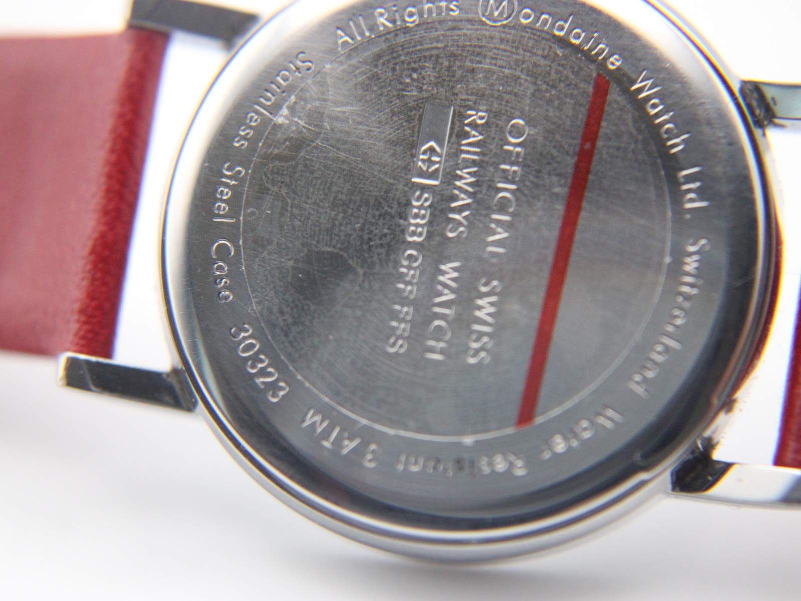 Close-up of the Mondaine watch stainless steel case back with engravings "30323" and "Water Resistant 3 ATM".