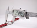Digital caliper measuring the watch case diameter at 29.86mm.