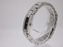 Oblique side view of the Gucci 4600L on a clear display stand, highlighting the bracelet links and slender case profile.