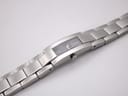 Top-down view of the Gucci 4600L watch with its integrated stainless steel bracelet laid flat, showcasing the full length.