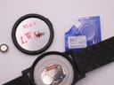 Front view of black Mondaine SBB CFF FFS Essence watch with white markers and red seconds hand