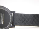 The Mondaine watch displayed inside a green watch box with a cream interior