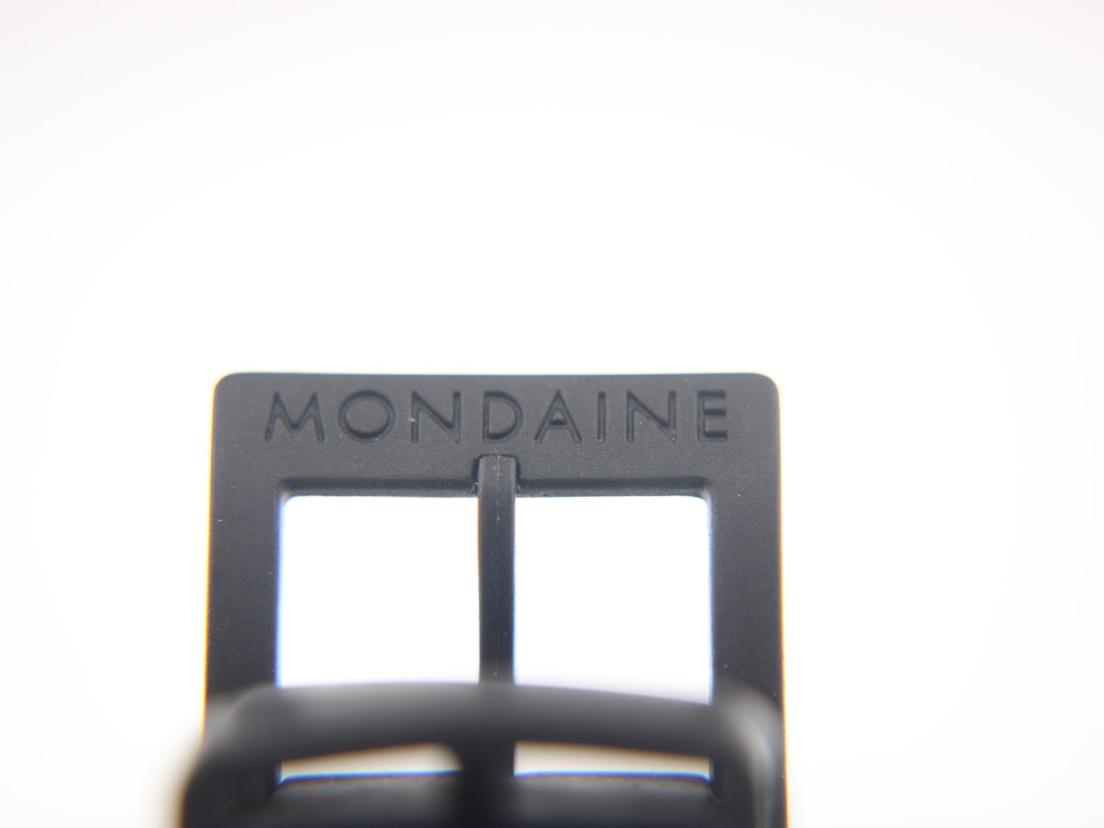 Close-up of the signed Mondaine buckle, showing the embossed 'MONDAINE' text