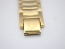 Close-up of the gold-tone folding clasp, displaying the embossed "MC" logo.