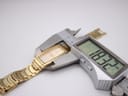 Digital caliper measuring the length of the watch case, displaying 39.32 mm.