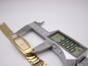 Digital caliper measuring the width of the watch case, displaying 18.86 mm.