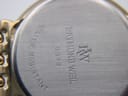Close-up of the watch's stainless steel case back with engraved 'Raymond Weil Genève 5549' and 'Water Resistant' text.