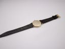 Back view of the Raymond Weil watch and its brown leather strap, showing "G16" marking near the lug, indicating lug width.