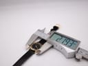 Digital caliper measuring the case diameter of the Raymond Weil Geneve watch, displaying a measurement of 21.93mm.