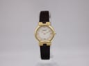 Front view of the Raymond Weil Geneve 9932 ladies watch with gold case, white dial, and brown lizard-style leather strap.