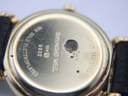 Close-up of the watch case back, showing '18K Gold Electroplated 10M', 'Raymond Weil Geneve 9932', 'Water Resistant', and visible surface corrosion.
