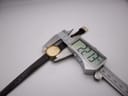 Digital caliper measuring the width of the Raymond Weil watch case at 22.13mm, positioned next to the watch.