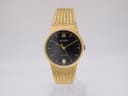 Front view of the Accurist gold-plated quartz watch with a black dial and gold mesh bracelet.