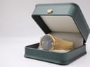 Accurist watch displayed in an open dark green presentation box on a white background.