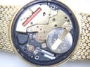 Detailed view of the Accurist quartz movement with the case back removed, showing the Swiss Made battery.