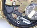 Extreme close-up of the Accurist quartz movement showing 'seven jewels' and internal components.