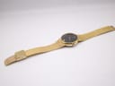 Full length view of the Accurist watch and gold mesh bracelet laid flat.