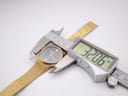 Digital caliper measuring the case diameter of the Accurist watch, displaying 32.06mm.