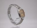 Side view of the Dunhill Millennium watch on a clear stand, highlighting its slim profile.