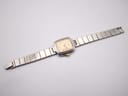 Top-down view of the Dunhill Millennium watch with its two-tone bracelet extended.