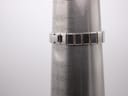 Watch bracelet on a wrist sizing cone, showing a circumference measurement of 155mm.