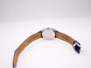 View of the underside of the blue leather strap, showing '20 GENUINE LEATHER' marking.
