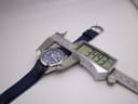 Digital caliper measuring the Rotary watch case diameter, displaying 34.93mm.