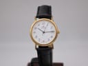 Front view of the gold-tone Sewills Classic Date watch with a white dial, black Arabic numerals, and a black leather strap.