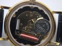 Detailed internal view of the open case back, revealing the Swiss Ronda 5 jewels quartz movement and a Renata battery.