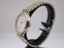 Side profile view of the Rotary 3705 watch on a stand, showing the gold-tone crown and bezel detail.