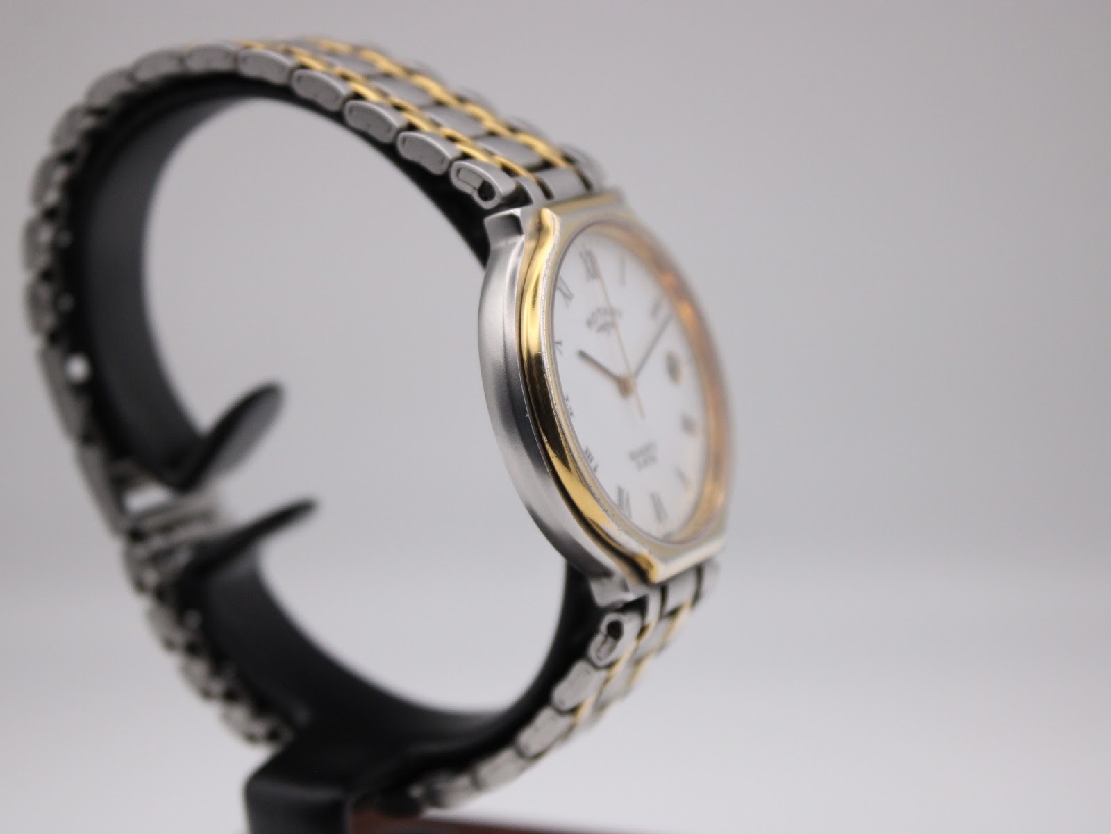 Another side profile view of the Rotary 3705 watch on a stand, highlighting the two-tone bracelet and case design.
