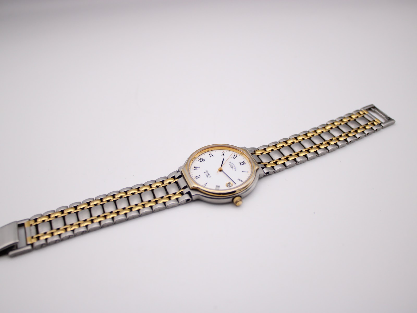 Full view of the Rotary 3705 watch and its two-tone integrated bracelet laid flat, showcasing the overall design.