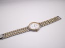 Full view of the Rotary 3705 watch and its two-tone integrated bracelet laid flat, showcasing the overall design.