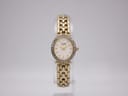 Front view of the Citizen 5920-S023871 gold-tone quartz watch with oval case and sparkling stone bezel on a display stand.