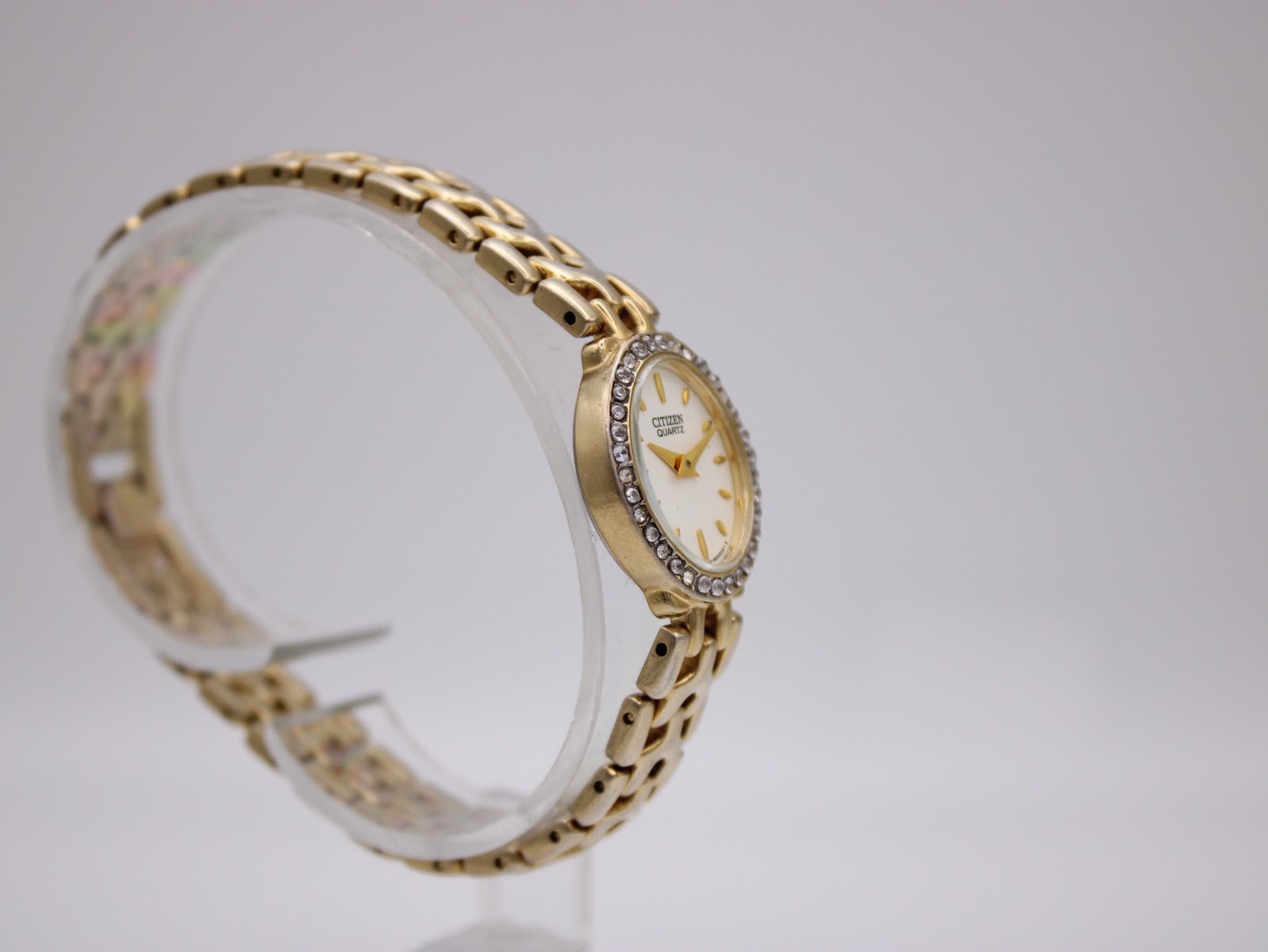 Another angled side view of the Citizen watch, highlighting the bezel stones and bracelet design.