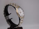 Angled side view of the Maurice Lacroix two-tone watch, highlighting the 'bamboo' style gold-plated bezel.