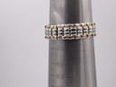 The two-tone bracelet displayed on a wrist sizing cone, indicating a fit up to 18.5cm.