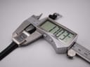 Digital caliper measuring the Gucci 2300L case width, displaying 17.03 mm.