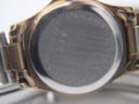 Close-up of the brushed stainless steel case back with "Rotary", "Stainless steel back", "Water resistant", and reference numbers engraved.