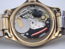 Close-up view of the Swiss quartz movement inside the watch, showing the battery and electronic components.