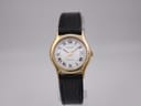 Front view of gold PVD Tissot Stylist dial with white face, Roman numerals, and date window