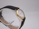 Side view of the Tissot Stylist, showing the slim profile of the gold-plated case and crown