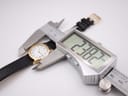 Digital caliper measuring the case diameter of the Tissot Stylist, showing 22.82mm on the display
