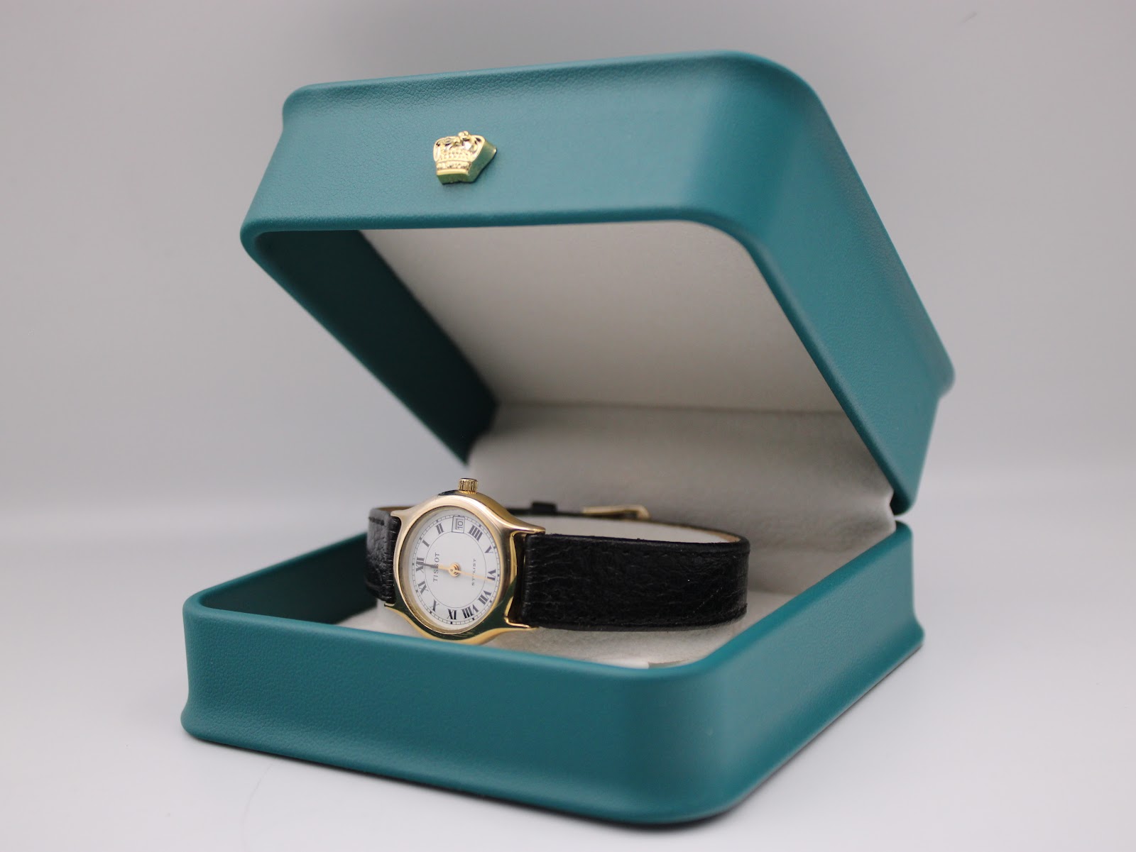 The Tissot Stylist watch presented open in a green non-original gift box